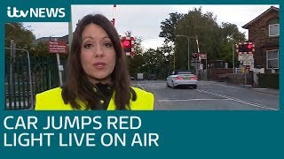 Car jumps red light at level crossing live on air  ITV News [upl. by Adnerol]