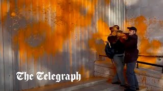 Passerby wrestles with Just Stop Oil protester in latest paint spray stunt [upl. by Ottie]