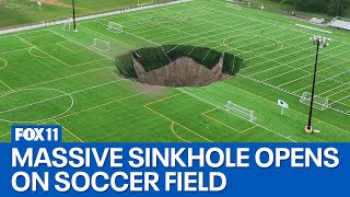 Video captures moment sinkhole opens on soccer field [upl. by Aicsila]