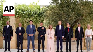 G7 leaders pose for photographers as they prepare to tackle global issues [upl. by Wiburg]