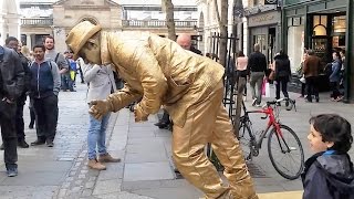 Golden man London street performer floating and levitating trick Covent Gardens [upl. by Ahsieat]