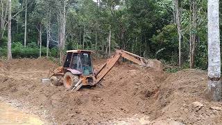 Case backhoe making fish pond [upl. by Humpage]