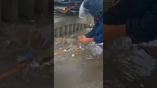 Clean up trash clogged culvert drain under raindrops shorts cleaning satisfying plastic [upl. by Larue]