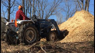 Using the Ford 1700 Tractor to Fill a Soft Spot with Wood Chips [upl. by Eralcyram512]