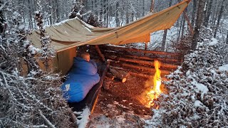 Winter Camping in Snow Storm with Survival Shelter amp Bushcraft Cot [upl. by Erreipnaej]