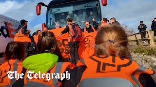 Driver ploughs through Just Stop Oil protesters blocking migrant coach heading to Bibby Stockholm [upl. by Horlacher]