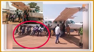 This Happens Only in South Sudan Plane Experienced Flat Tire Being Pushed Out of Runway in Kuajok [upl. by Nalahs]