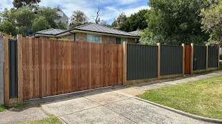 Colorbond fence with exposed posts and vertical merbau cladded gates [upl. by Elletsirhc]