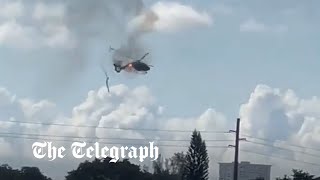 Burning helicopter crashes in Florida leaving two injured [upl. by Eerased]