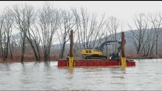 Barge carrying excavator drifted down Deerfield River [upl. by Sinnal]