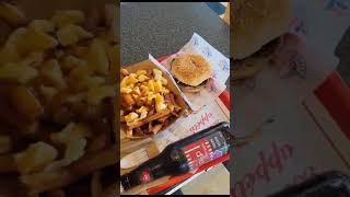 Food to Eat in Quebec Canada  POUTINE poutine foodie quebec canada steamedbuns [upl. by Henghold324]