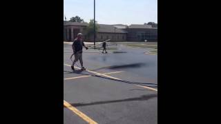 Dual spray tip asphalt sealcoating wand Michigan style parking lot sealing [upl. by Aronas773]