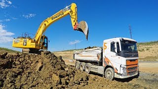 Komatsu HB 365LC Cat 730C2 and Volvo FH500 tridem [upl. by Yatnwahs480]