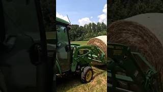 John Deere 3046R compact tractor handling round hay bales with no problem johndeere tractor [upl. by Atnauqal]