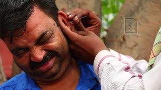 Ear Waxing  Traditional ear cleaner in India [upl. by Llerrac22]