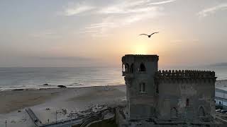 4K Aerial Views Tarifa Spain at Sunset with Morocco Coastline Backdrop [upl. by Firooc]