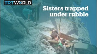 Syrian girl dies trying to save sister dangling from bombed home [upl. by Gmur]