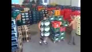 Workers sort beer bottle cases a recycling warehouse [upl. by Sirraj]