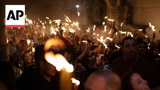 Eastern Orthodox worshippers throng Holy Fire ceremony in Jerusalem [upl. by Ettenad]