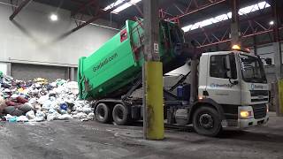 Emptying Gradeall Hook Lift Portable Waste Compactor [upl. by Ahsenyt]