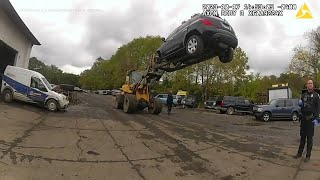 Auto shop employees use forklift to stop car theft police body cam video shows [upl. by Frasch307]