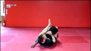 Triangle choke from London Sean Williams Guard [upl. by Anaujnas461]