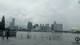 A beautiful path around Marina Bay Sands offers scenic views of the bay and the skyline [upl. by Keynes]