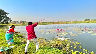 Fishing Video  A village woman and a boy are fishing with a hook in a lotus pond  best fishing [upl. by Eskill]