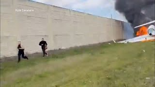 Survivors run from plane wreckage on I75 [upl. by Ranitta26]